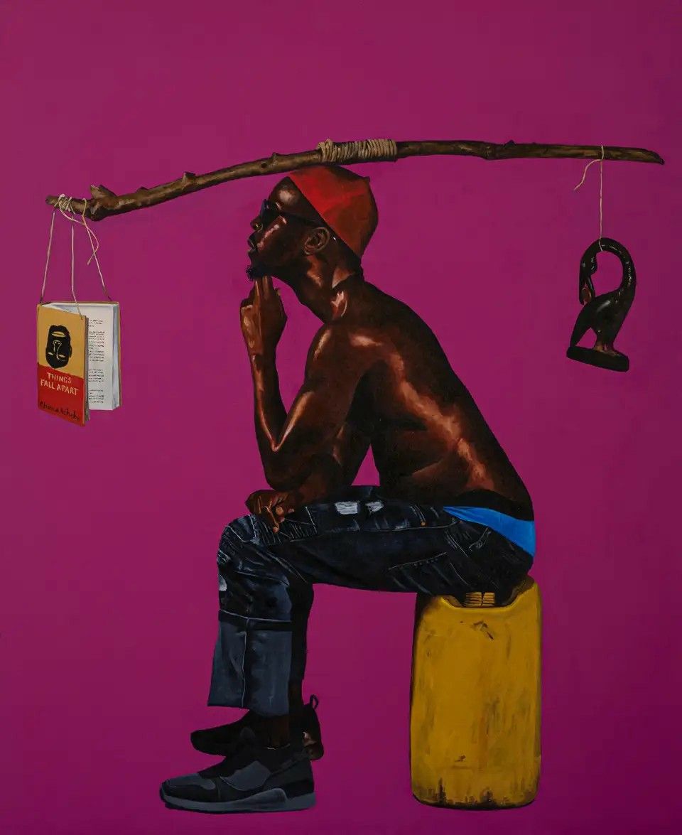 Ken Smoke seated against a purple background