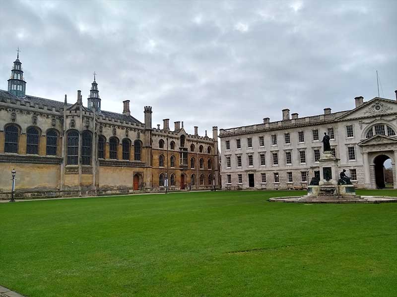 photograph of buildings on a green