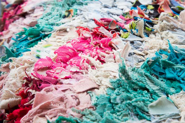 upcycled clothing transformed into a shag carpet