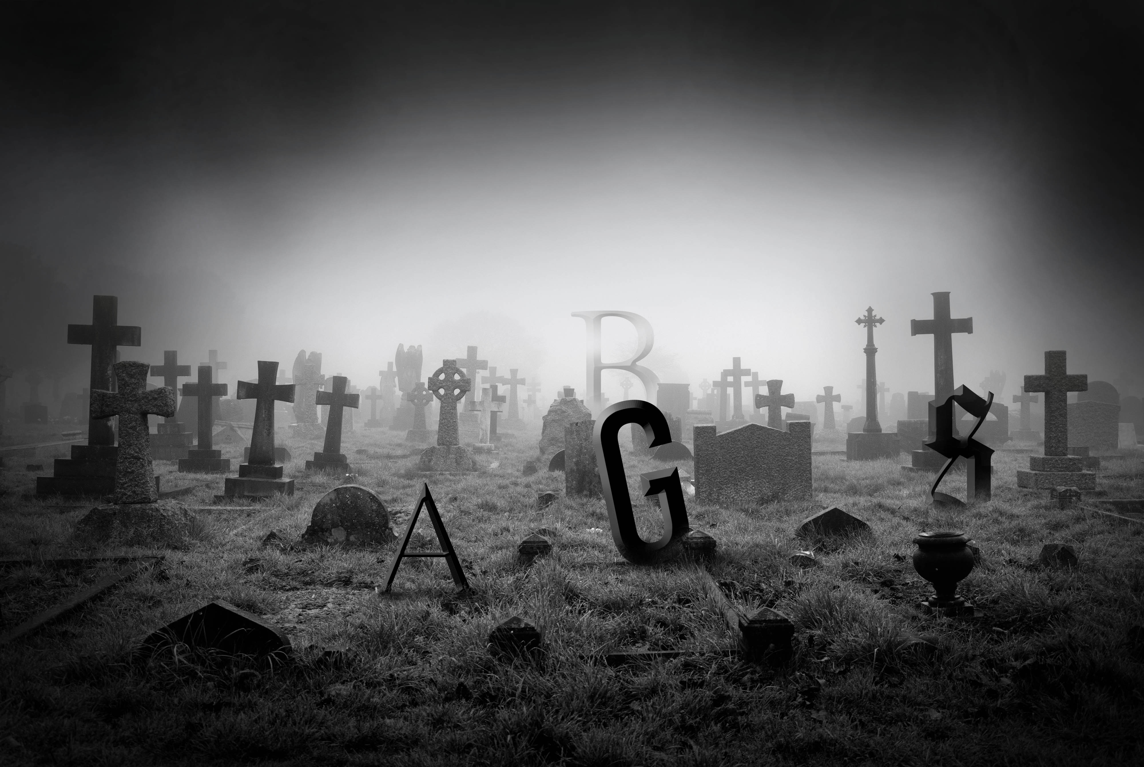 Foggy graveyard with giant letters standing among the tombstones